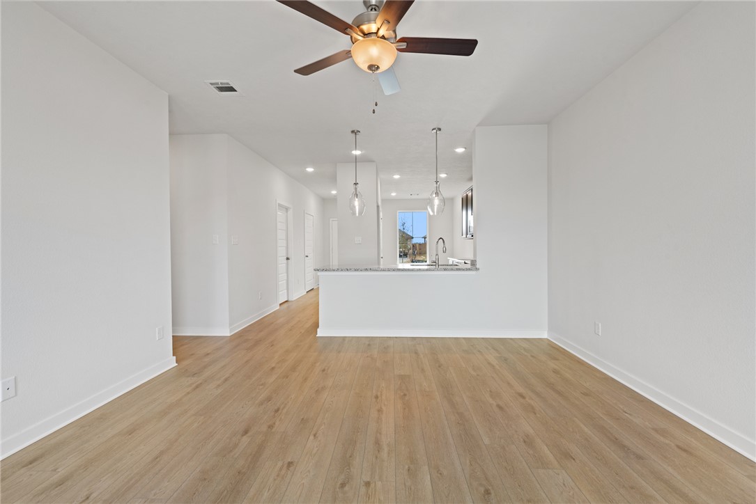 2412 Rooke Road Bryan, TX 77807 - Photo 15 of 35 a view of kitchen and hall with wooden floor