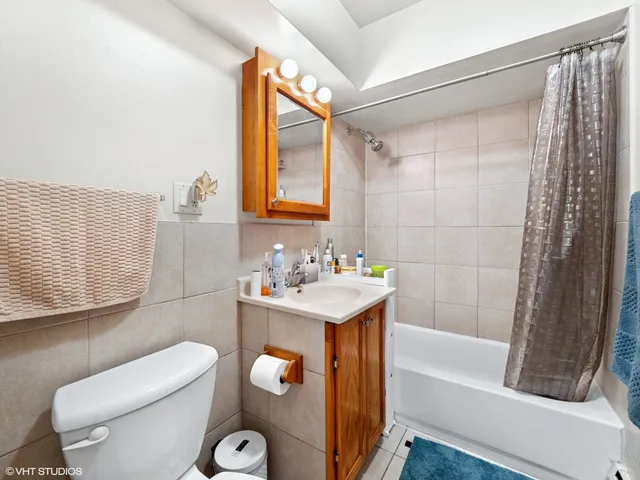 a bathroom with a sink a toilet and bathtub