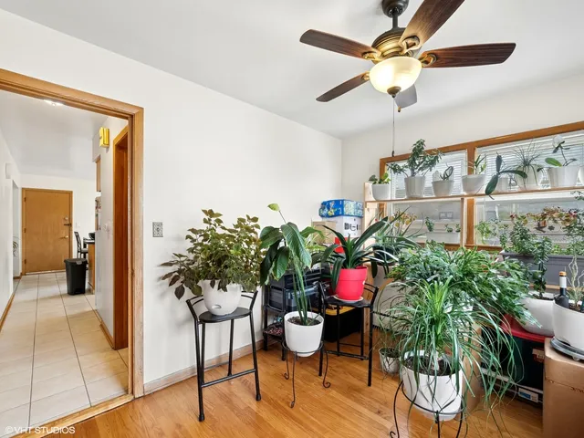 a room with stainless steel appliances a couch and a view of kitchen
