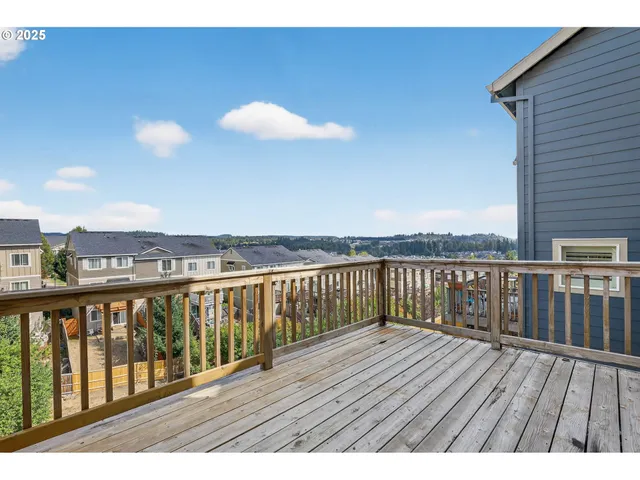 a view of wooden balcony with outdoor space