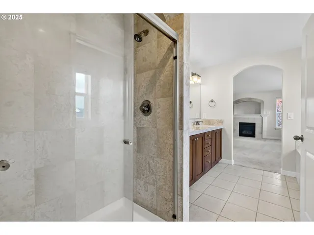a spacious bathroom with a shower and a tub