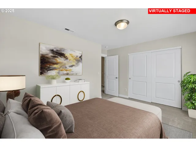 a living room with a bed and furniture