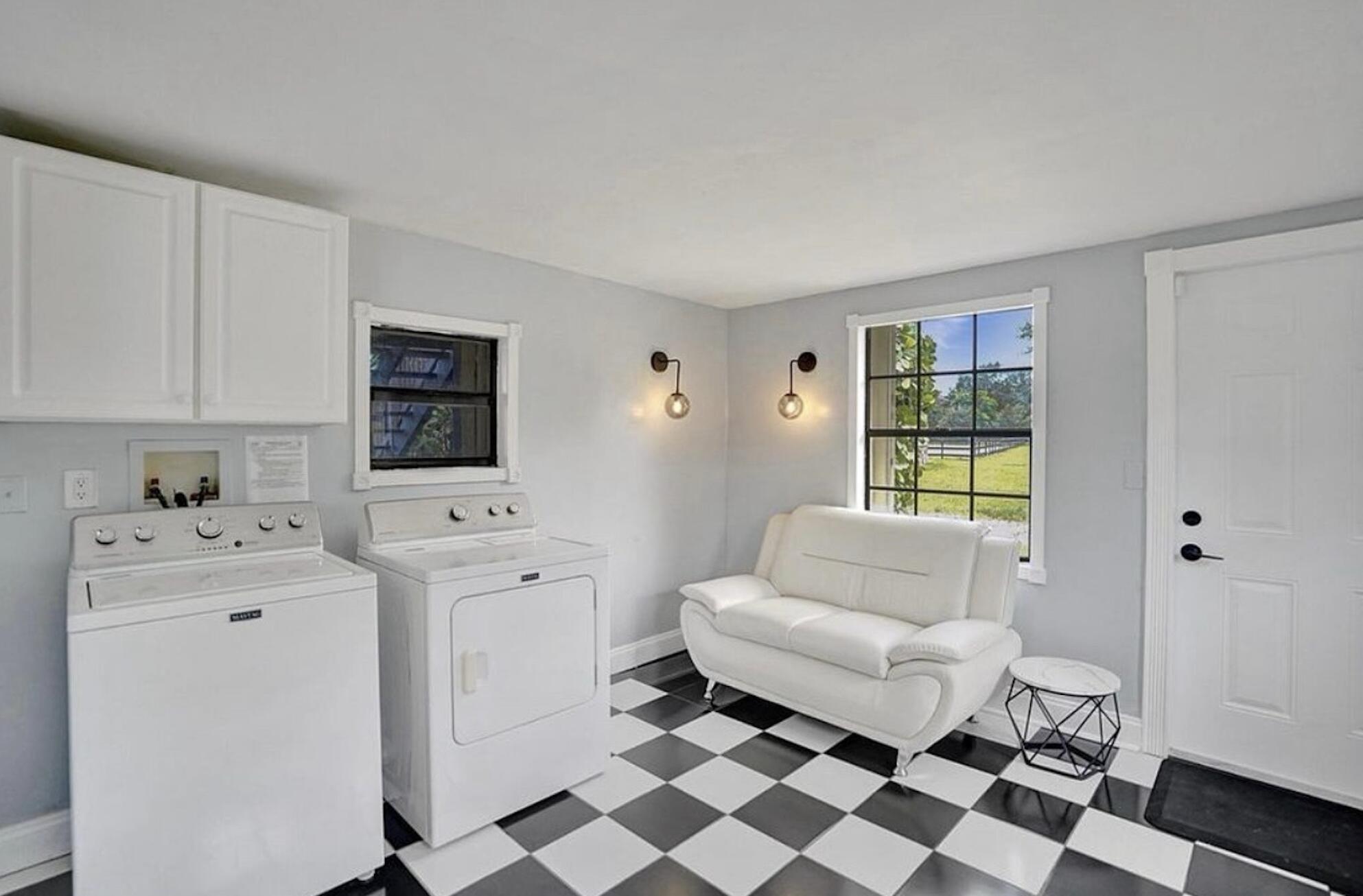 502 Rambling Dr Circle, Unit #2 Wellington, FL 33414 - Photo 16 of 18 a living room with furniture and a window