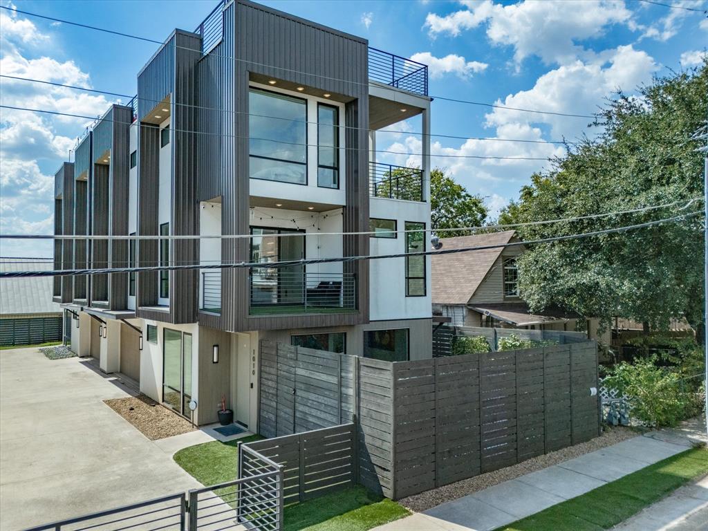 1010 Mobile Street Dallas, TX 75208 - Photo 1 of 1 a backyard of a house with wooden floor and outdoor seating