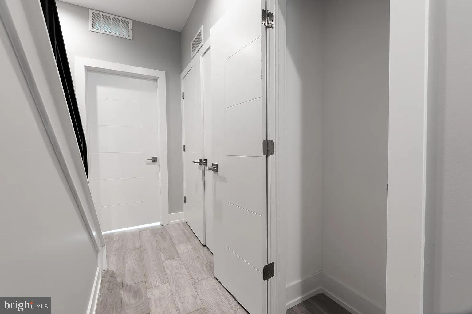 2055 Tasker Street Philadelphia, PA 19145 - Photo 20 of 40 a view of a hallway with wooden floor and closet