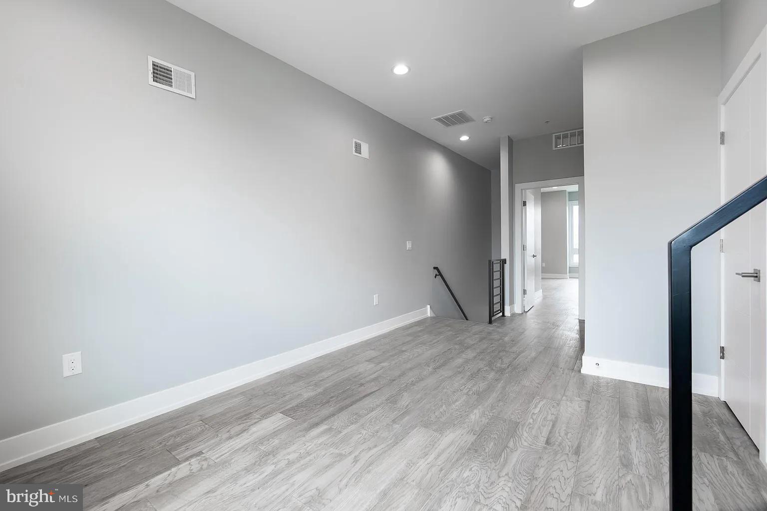 2055 Tasker Street Philadelphia, PA 19145 - Photo 27 of 40 a view of a hallway with wooden floor