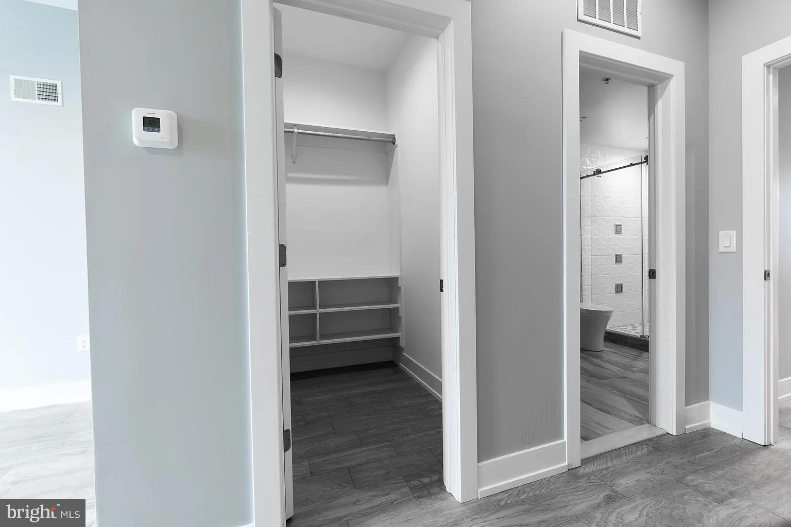 2055 Tasker Street Philadelphia, PA 19145 - Photo 28 of 40 a view of a hallway with a wooden closet