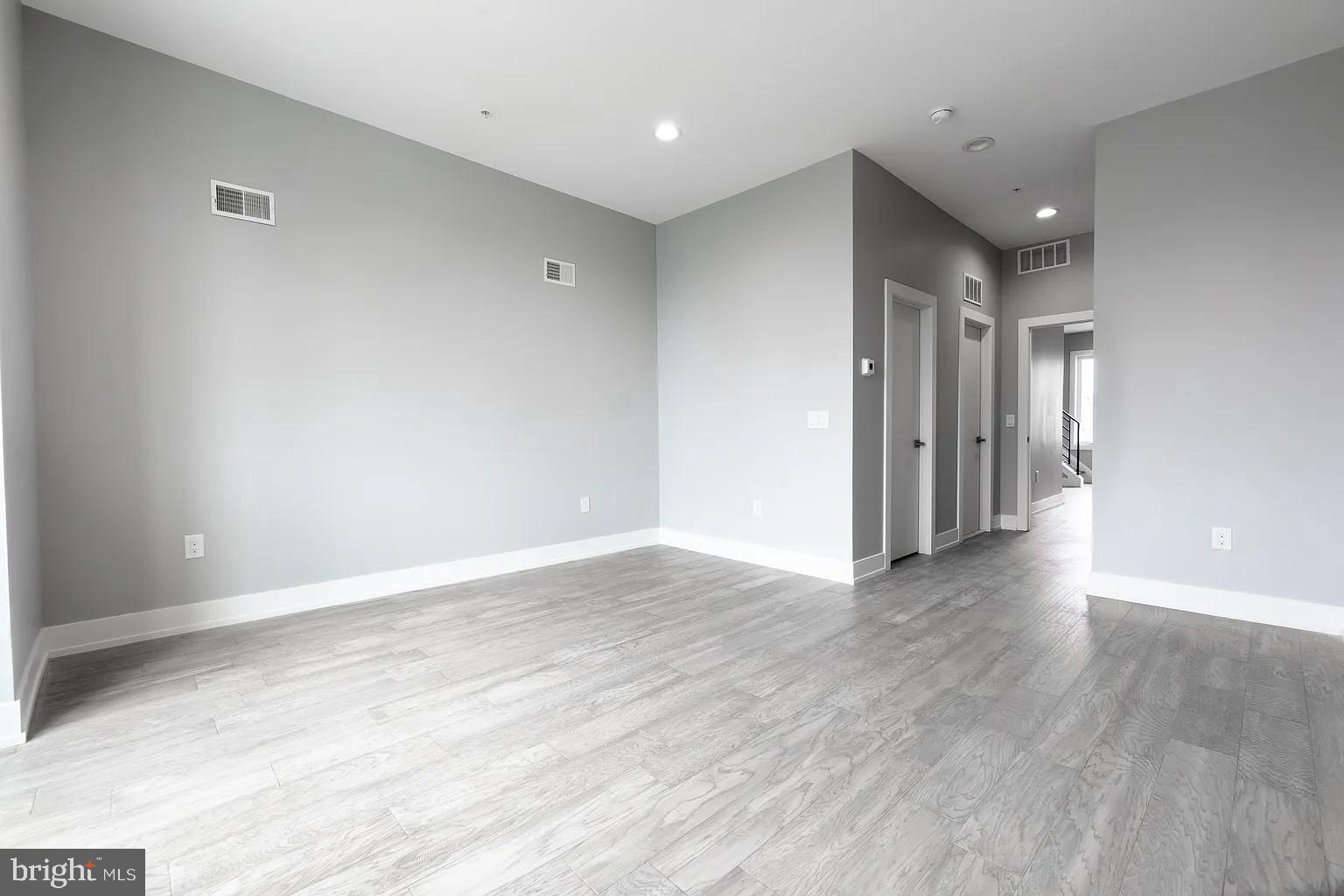 2055 Tasker Street Philadelphia, PA 19145 - Photo 29 of 40 a view of a room with wooden floor and staircase