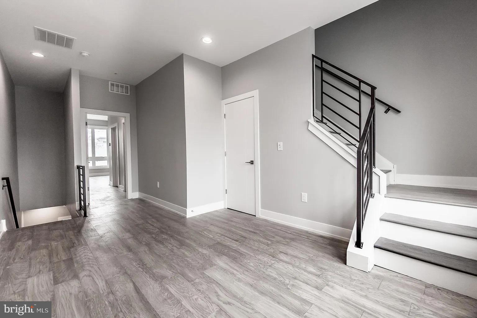 2055 Tasker Street Philadelphia, PA 19145 - Photo 33 of 40 wooden floor in an empty room with a window