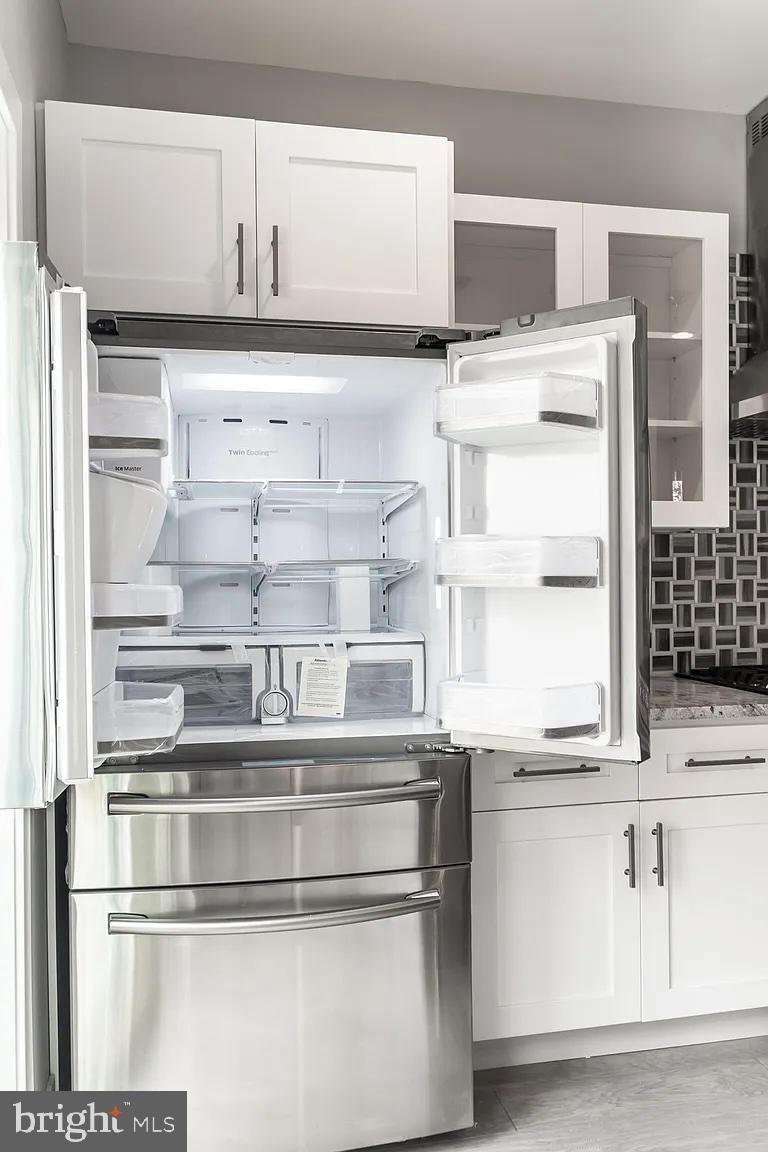 2055 Tasker Street Philadelphia, PA 19145 - Photo 10 of 40 a close view of kitchen island with appliances and cabinets