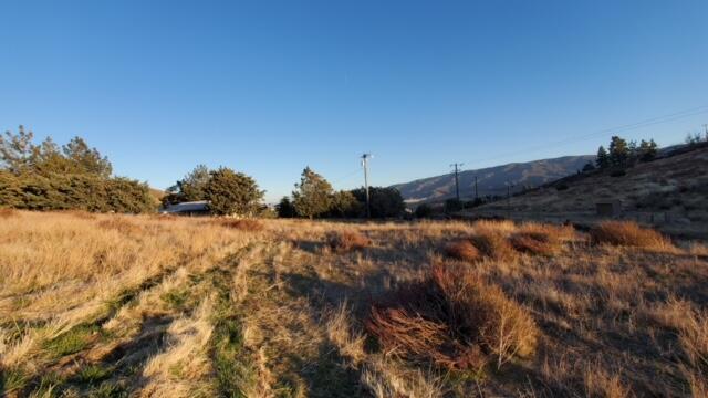 Northside Drive Palmdale, CA 93551 - Photo 2 of 25 a view of a field of mountains and bushes