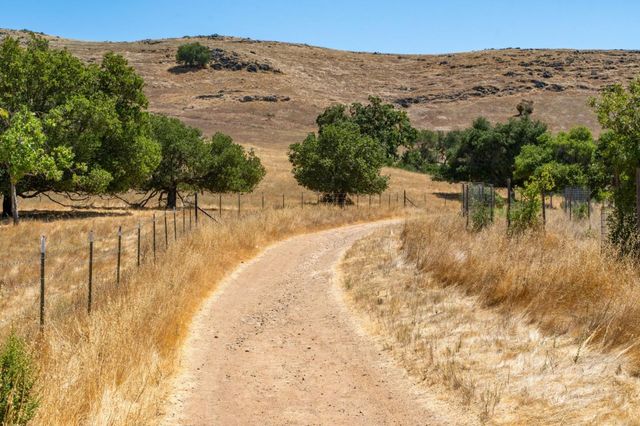 a view of a backyard of the house