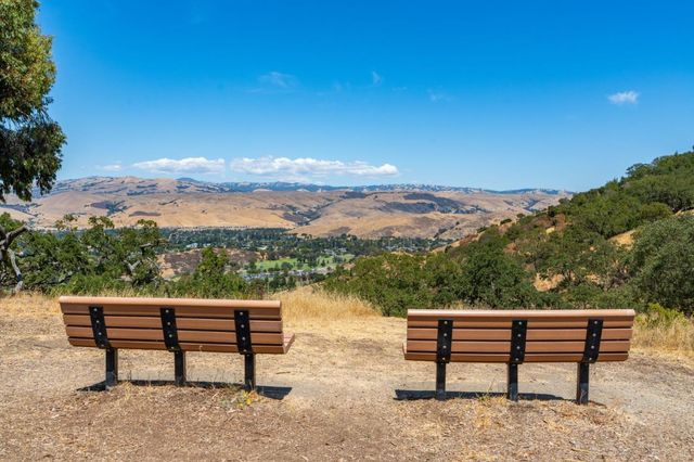 a view of a bench in front of a lake