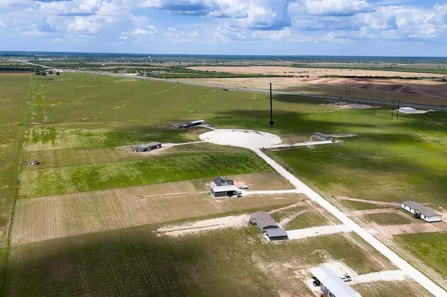 a view of a lake with a house in the background