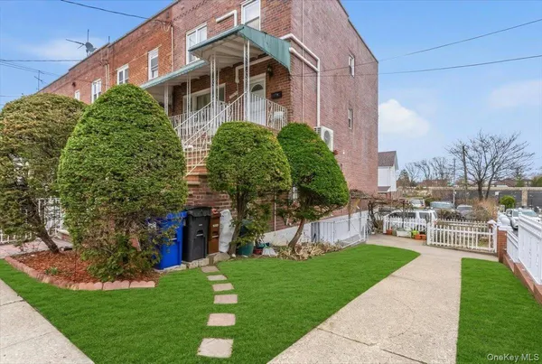 a view of a building with a yard