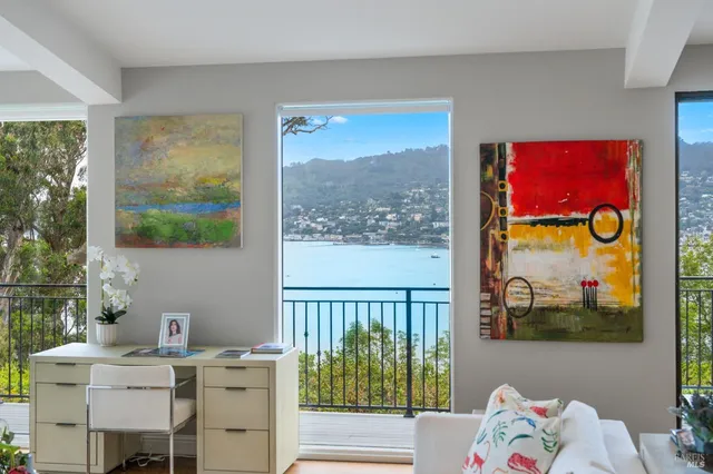 a workspace with furniture and window