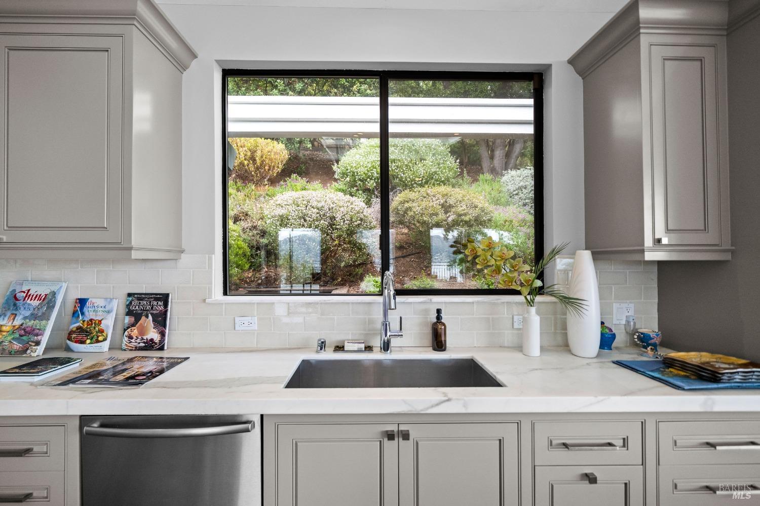 30 Eucalyptus Road Belvedere, CA 94920 - Photo 16 of 46 a kitchen with white cabinets and a window