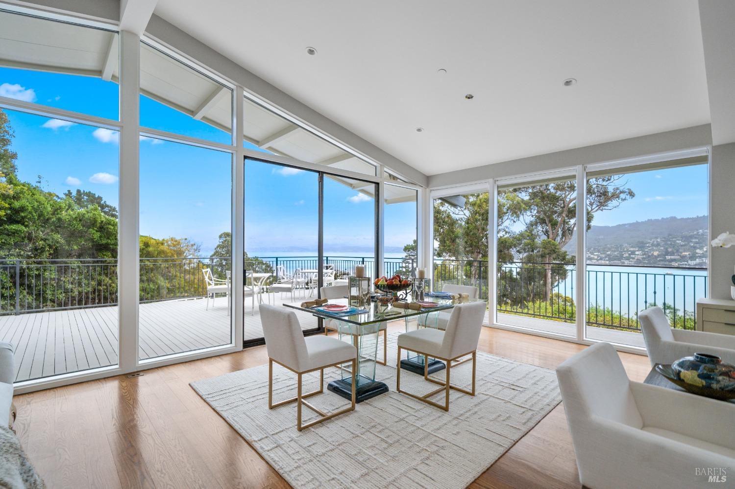 30 Eucalyptus Road Belvedere, CA 94920 - Photo 20 of 46 a living room with furniture and a floor to ceiling window