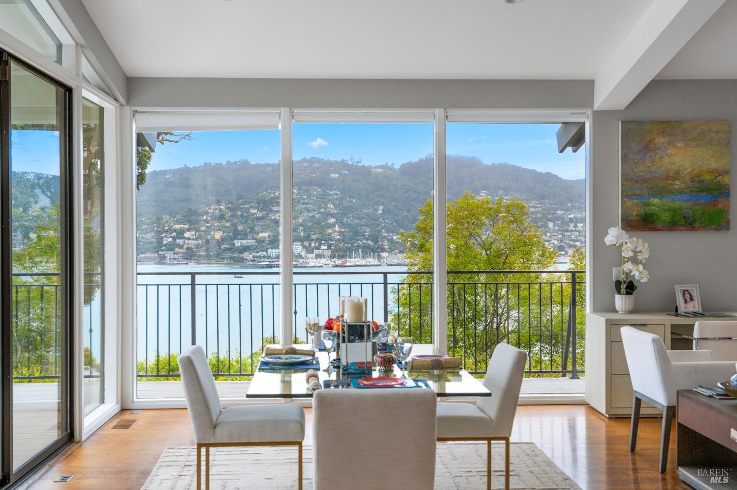 30 Eucalyptus Road Belvedere, CA 94920 - Photo 21 of 46 a dining room with furniture water view and a ocean view