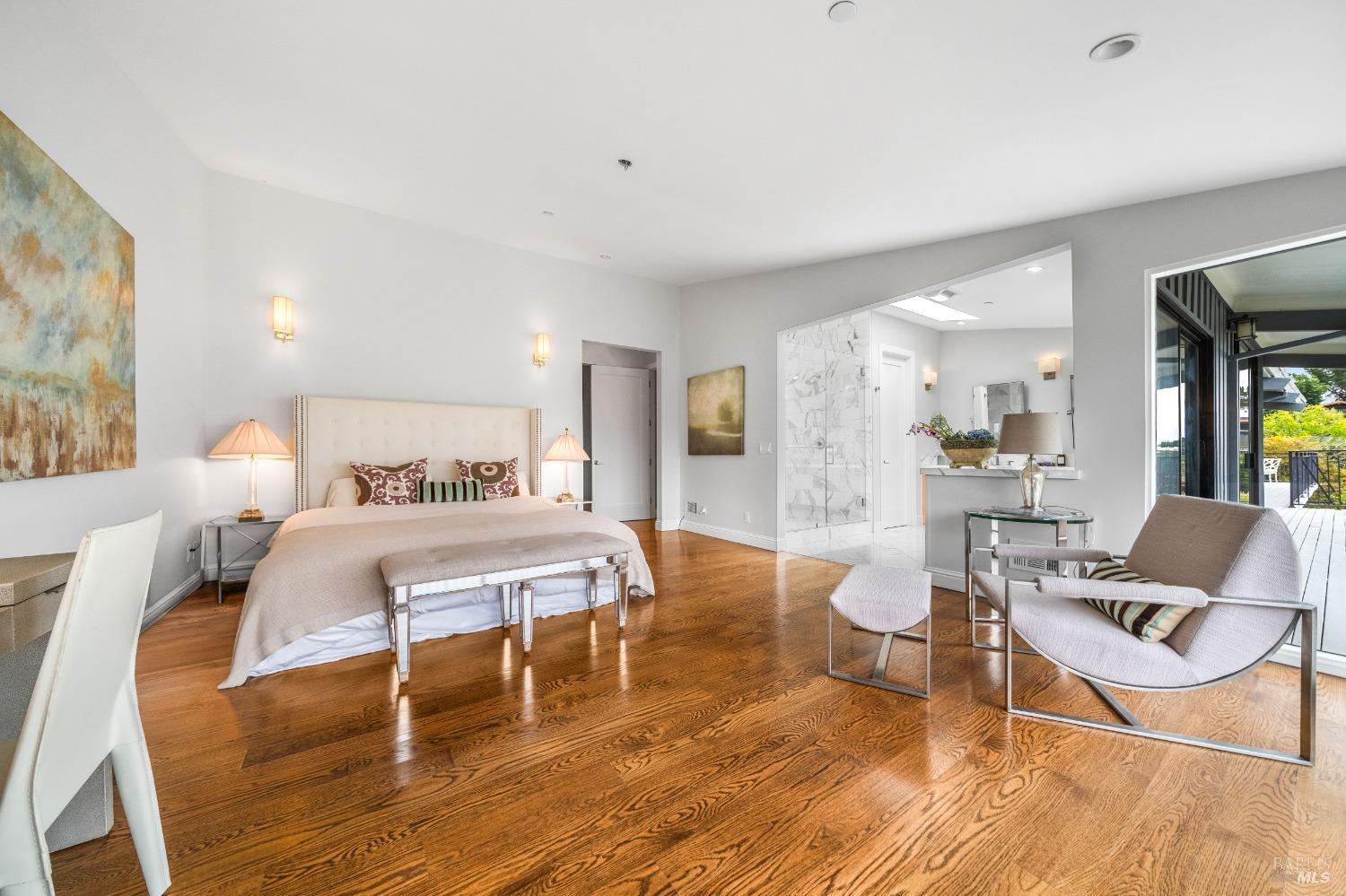 30 Eucalyptus Road Belvedere, CA 94920 - Photo 24 of 46 a bedroom with a bed and glass table chair