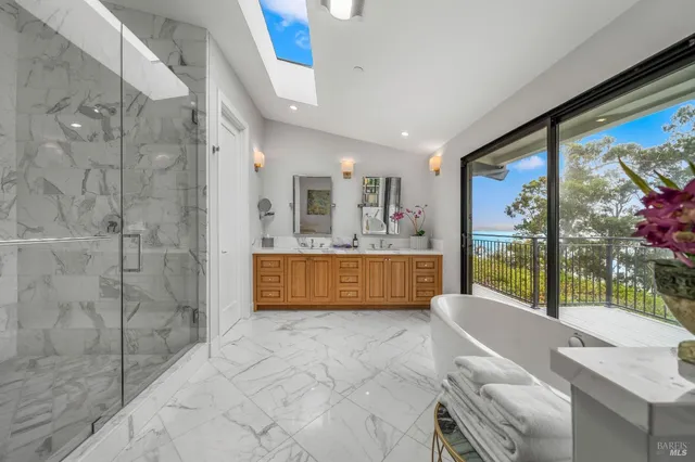a large bathroom with a tub and shower