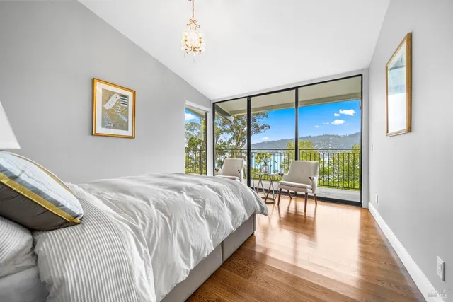 a bedroom with a bed and a table