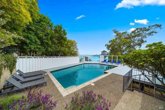 a view of a backyard with sitting area