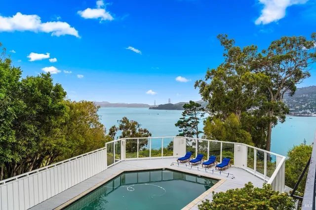 a view of a balcony with chairs
