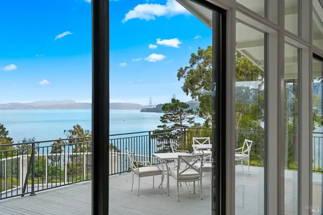 a view of a balcony with chairs