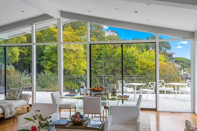 a living room with large windows