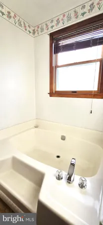 a view of a hallway with seating area