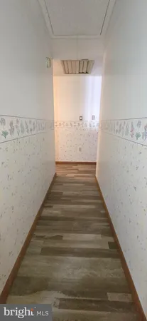 a view of balcony with wooden floor and fence