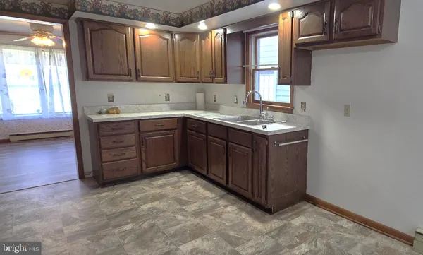 a kitchen with a cabinets and window
