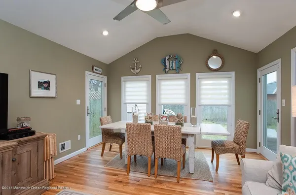 a spacious bedroom with a bed and a couch