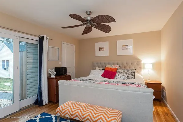 a bedroom with bed and a window
