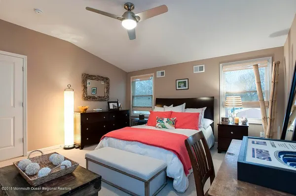 a view of a house with a door and wooden walls