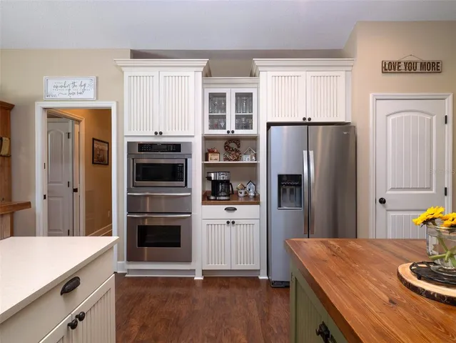 a kitchen with stainless steel appliances a refrigerator stove and sink