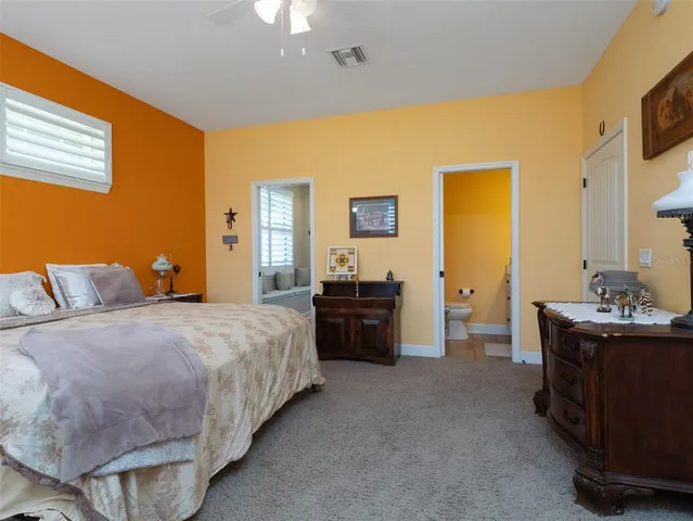 a bed room with a bed and furniture