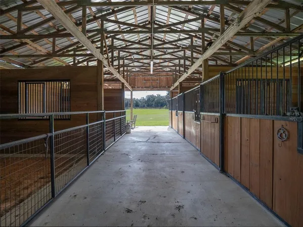 a view of walk in closet with clothes