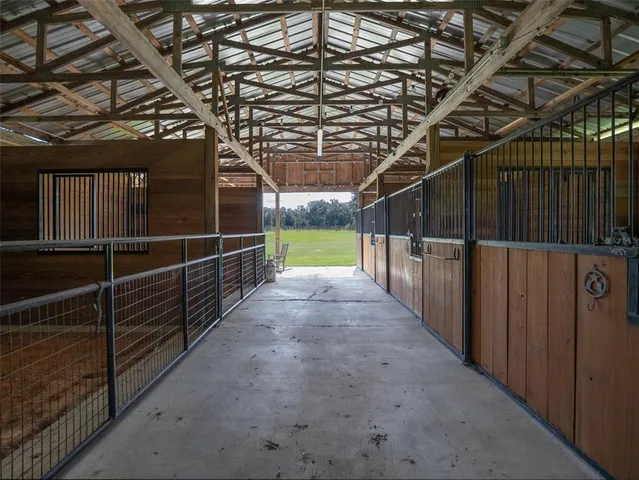 a view of walk in closet with clothes