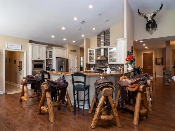 a view of a dining area with furniture and wooden floor