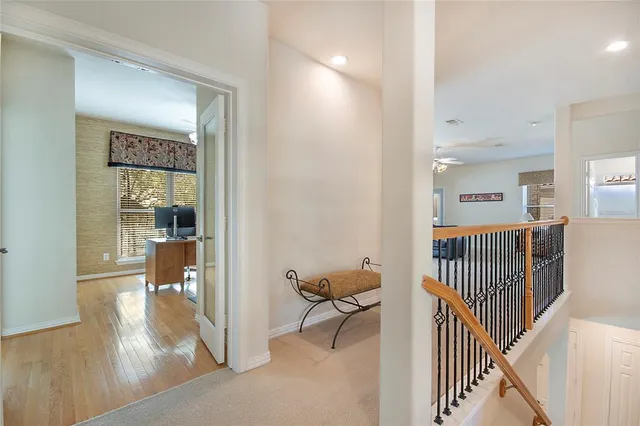 a view of a hallway view with living room and furniture