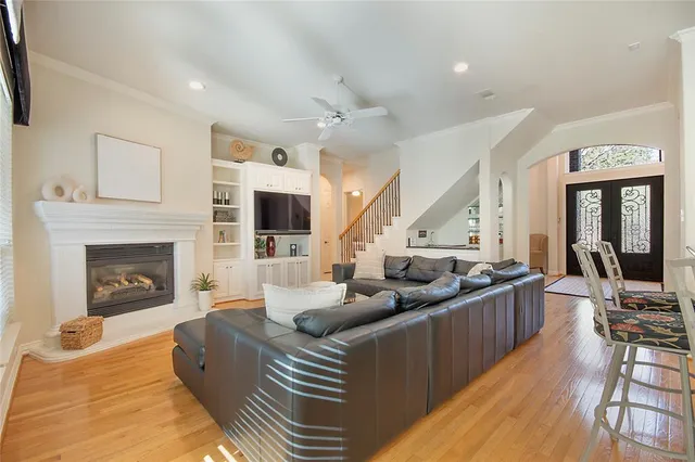 a living room with furniture fireplace and flat screen tv