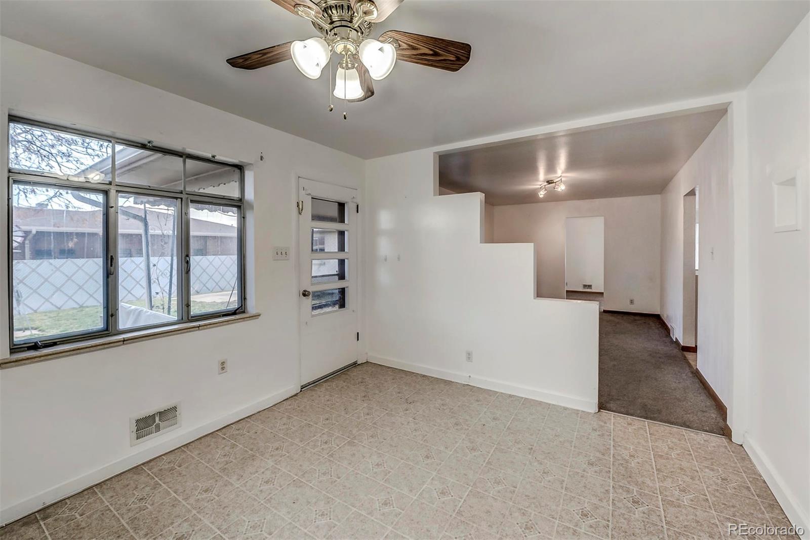 3880 Allison Street Wheat Ridge, CO 80033 - Photo 11 of 18 a view of an empty room with a window