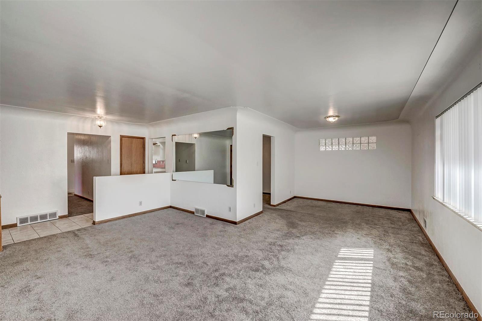 3880 Allison Street Wheat Ridge, CO 80033 - Photo 5 of 18 an empty room with windows
