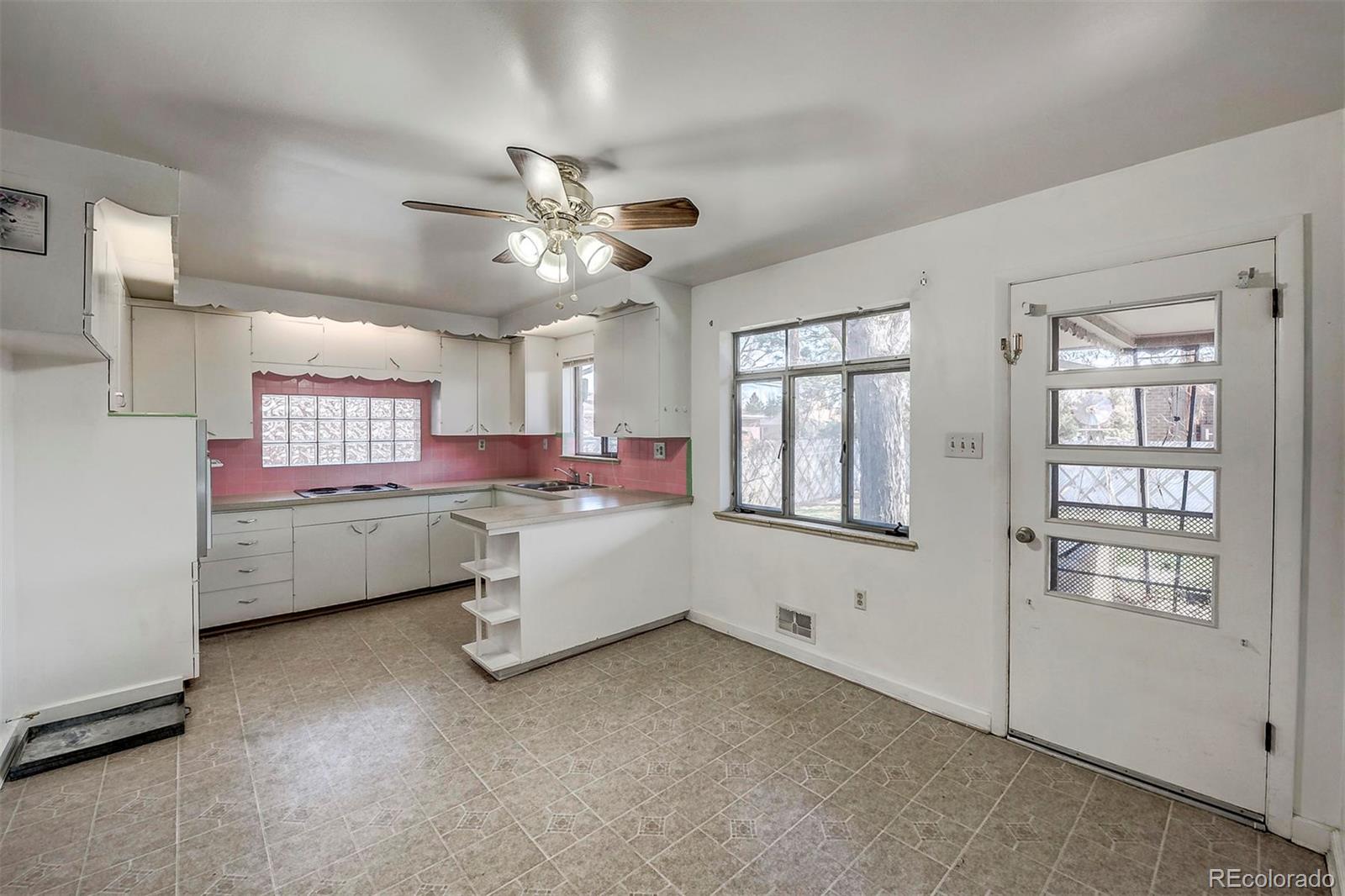 3880 Allison Street Wheat Ridge, CO 80033 - Photo 8 of 18 a view of room with window and cabinet