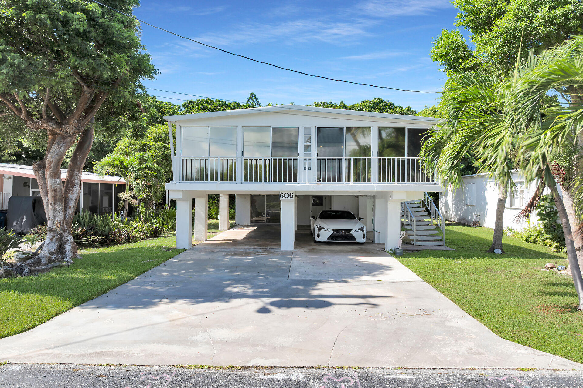 a view of a house with a yard and plants