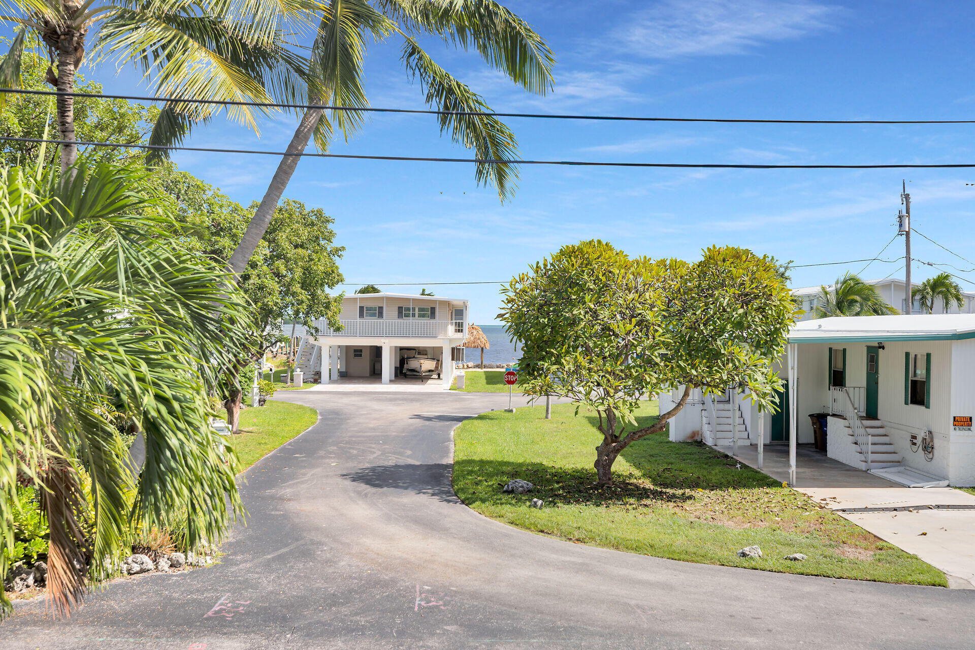 606 North Silver Circle Key Largo, FL 33037 - Photo 19 of 54 a front view of a house with garden