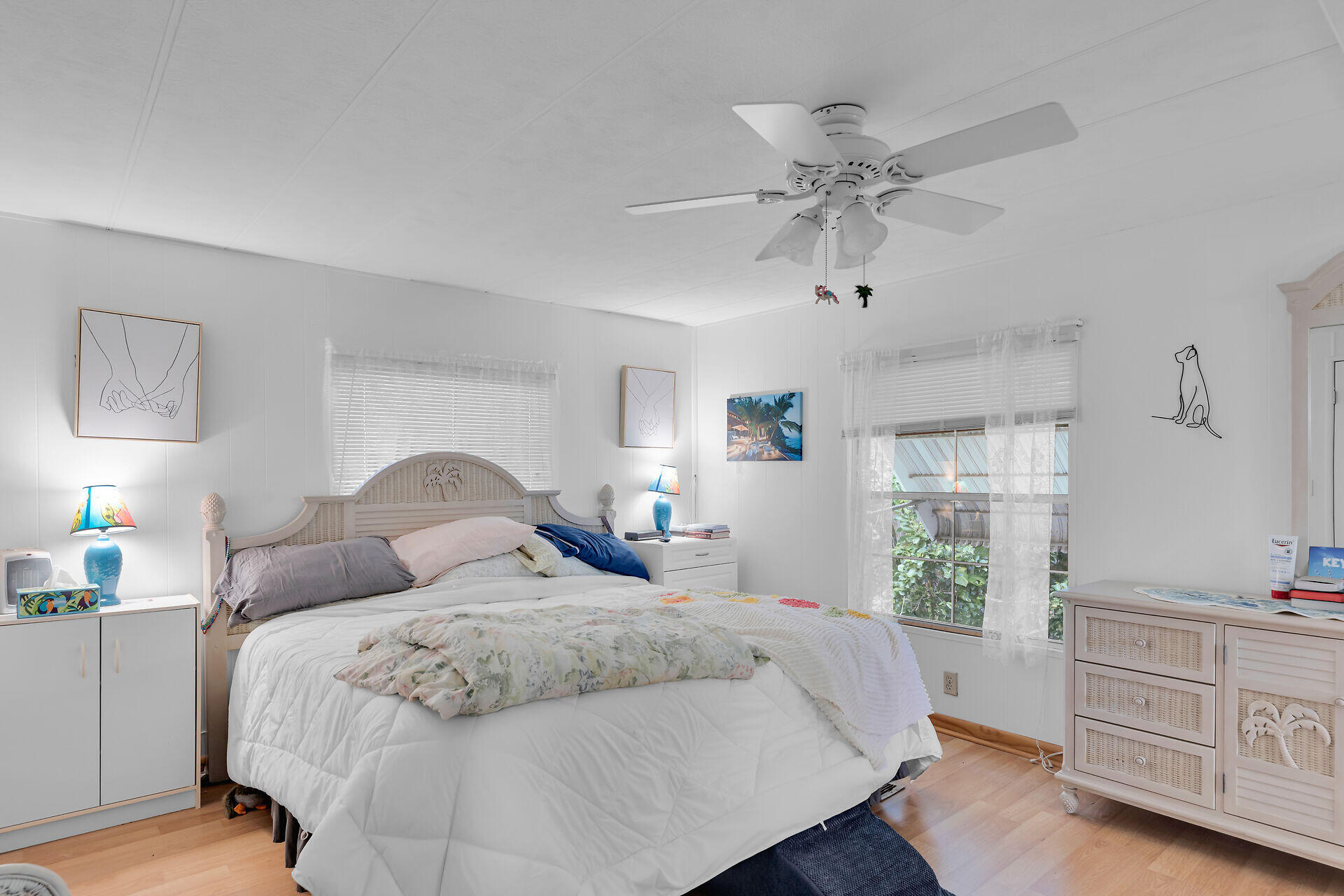 606 North Silver Circle Key Largo, FL 33037 - Photo 25 of 54 a bedroom with a bed and a dresser