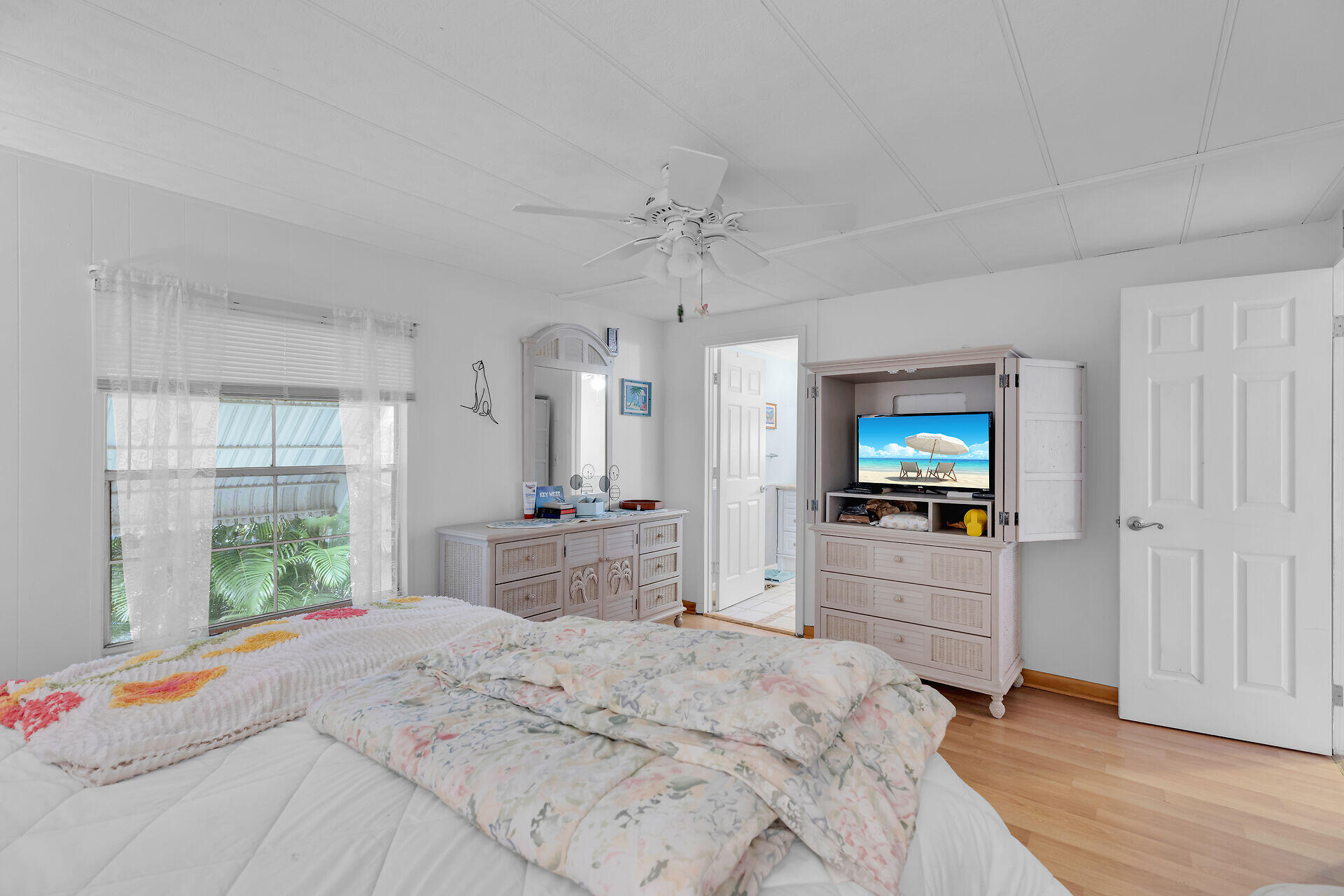 606 North Silver Circle Key Largo, FL 33037 - Photo 26 of 54 a bedroom with a bed and a flat screen tv